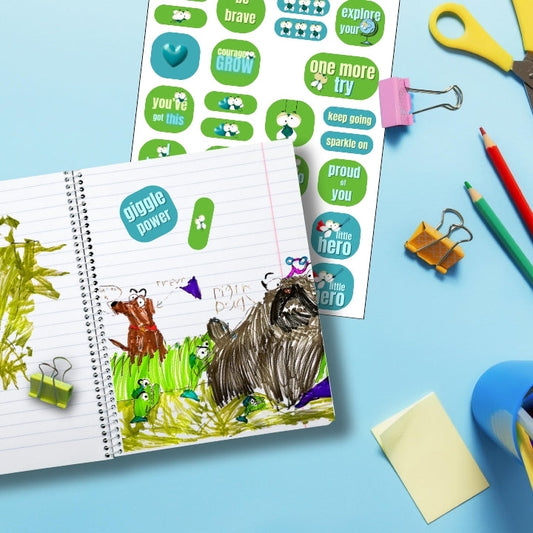 Mouche stickers for kids on a notebook page with a drawing, sheet of extra stickers, and colored pencils for creative fun